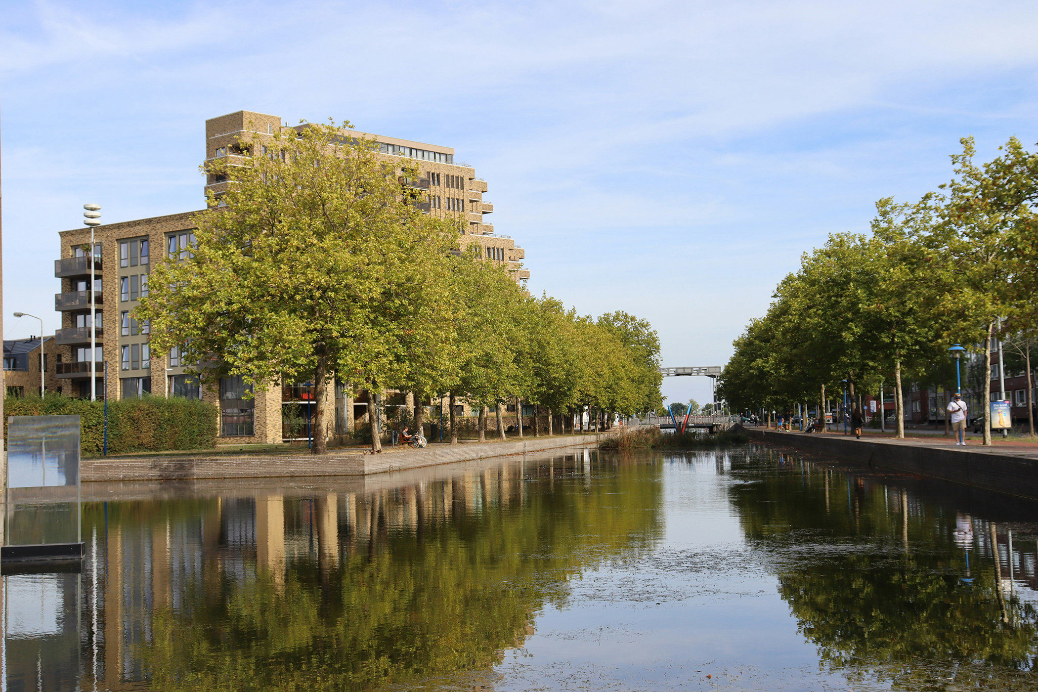 Eindhoven canal as it comes into the city with trees lining both sides. Metselaars Makelaardij also reaches into Eindhoven from Nuenen.
